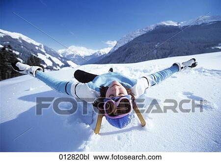 young woman relaxing on sledge in winter landscape View Large Photo Image Stock Image - young woman relaxing on sledge in winter landscape. Fotosearch
