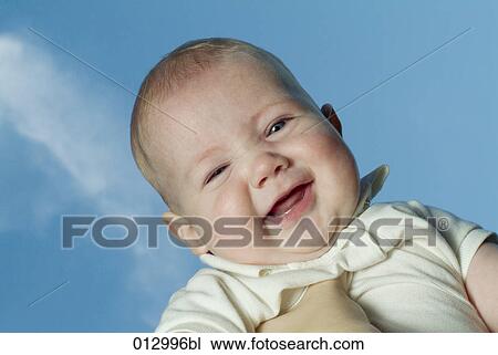 Stock Image - baby clothes, Vladimir Godnik, baby, babies, artificial light, 6-12 months. Fotosearch