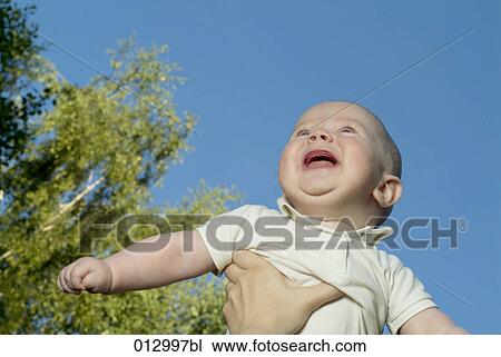Stock Image - baby clothes, Vladimir Godnik, baby, babies, artificial light, 6-12 months. Fotosearch