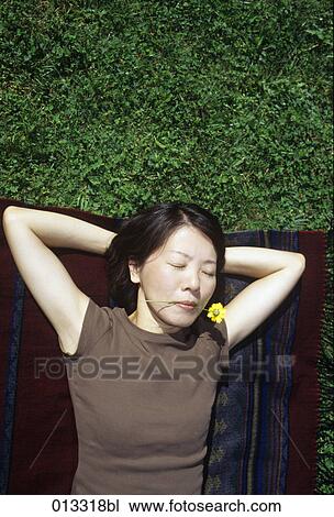 Stock Image - Tumi, adults, asian, black hair. Fotosearch