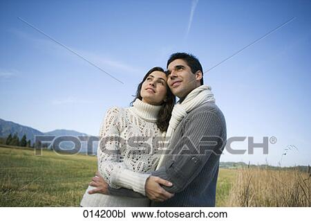 casually dressed couple standing in autumn landscape View Large Photo Image Stock Image - casually dressed couple standing in autumn landscape. Fotosearch