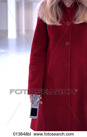 close-up of blond woman holding mobile View Large Photo Image Stock Image - close-up of blond woman holding mobile. Fotosearch
