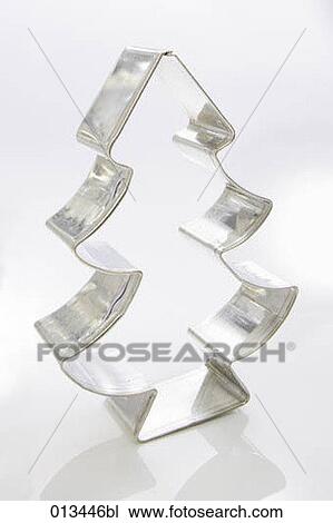 Stock Image - close-up of form for biscuits in shape of christmas tree. Fotosearch