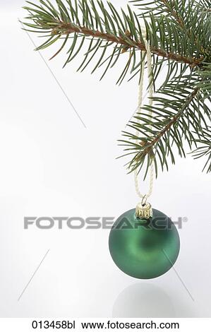 close-up of green bauble hanging on branch of christmas tree View Large Photo Image Stock Image - close-up of green bauble hanging on branch of christmas tree. Fotosearch