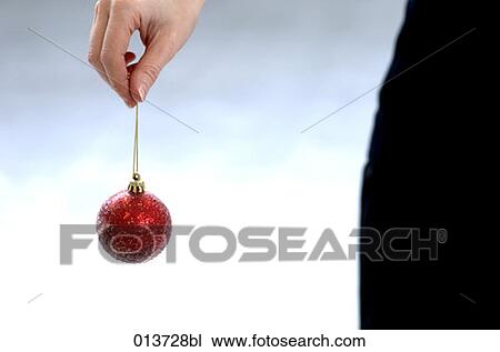 close-up of red bauble held by human hand View Large Photo Image Stock Image - close-up of red bauble held by human hand. Fotosearch
