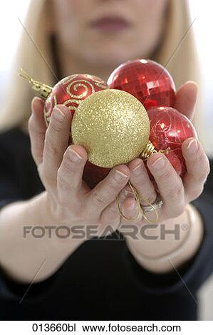 close-up of woman holding baubles in hands View Large Photo Image Stock Image - close-up of woman holding baubles in hands. Fotosearch