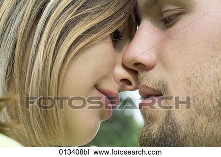 close-up of young couple about to kiss View Large Photo Image Stock Image - close-up of young couple about to kiss. Fotosearch