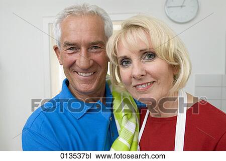 close-up portrait of mature couple in kitchen View Large Photo Image Stock Image - close-up portrait of mature couple in kitchen. Fotosearch