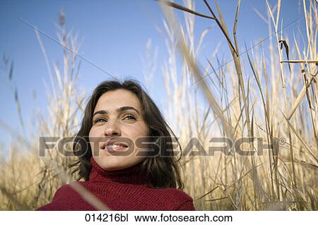 content looking woman lying in autumnal field View Large Photo Image Stock Image - content looking woman lying in autumnal field. Fotosearch