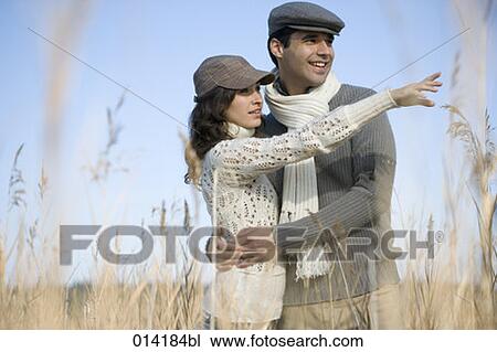 couple in reed woman showing direction View Large Photo Image Stock Image - couple in reed woman showing direction. Fotosearch