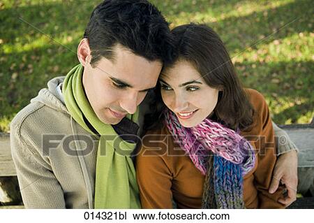 couple in tender embrace on bench outdoors View Large Photo Image Stock Image - couple in tender embrace on bench outdoors. Fotosearch