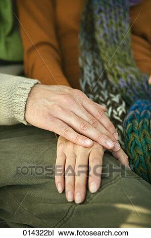 detail of woman and man tenderly holding hands View Large Photo Image Stock Image - detail of woman and man tenderly holding hands. Fotosearch