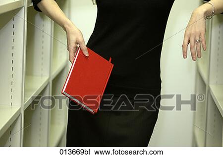 detail of woman holding book View Large Photo Image Stock Image - detail of woman holding book. Fotosearch