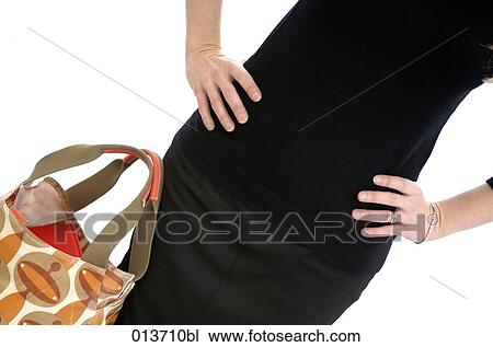 detail of woman in black dress with hand on hips View Large Photo Image Stock Image - detail of woman in black dress with hand on hips. Fotosearch