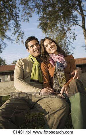 happy young couple sitting together in autumn View Large Photo Image Stock Image - happy young couple sitting together in autumn. Fotosearch