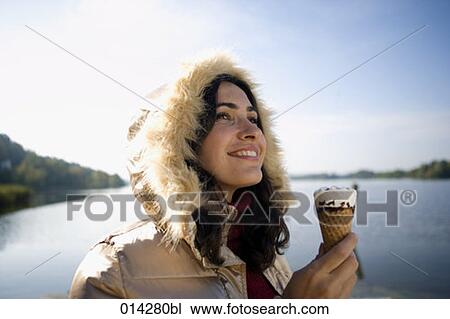 happy young woman in winter holding ice View Large Photo Image Stock Image - happy young woman in winter holding ice. Fotosearch