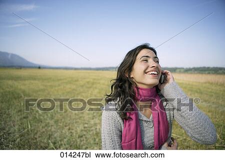 happy young woman with cellphone in autumn landscape View Large Photo Image Stock Image - happy young woman with cellphone in autumn landscape. Fotosearch