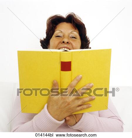 laughing woman hiding behind book View Large Photo Image Stock Image - laughing woman hiding behind book. Fotosearch