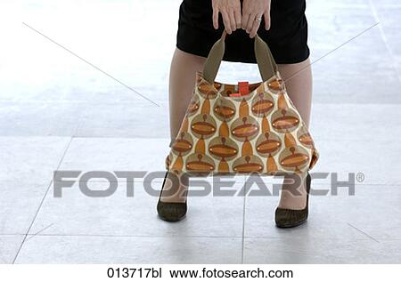 legs of woman with colourful handbag View Large Photo Image Stock Image - legs of woman with colourful handbag. Fotosearch