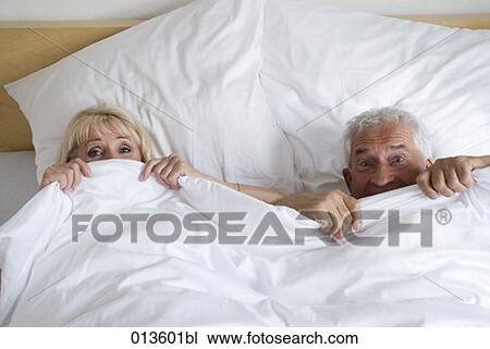 mature couple having fun in bed View Large Photo Image Stock Image - mature couple having fun in bed. Fotosearch