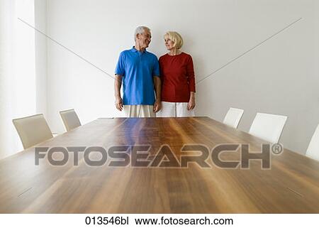 mature couple standing in room tenderly looking at each other View Large Photo Image Stock Image - mature couple standing in room tenderly looking at each other. Fotosearch