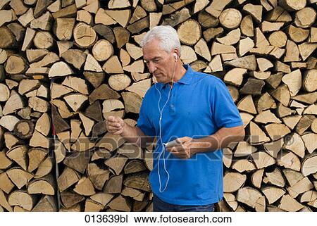 mature man listening to music on ipod View Large Photo Image Stock Image - mature man listening to music on ipod. Fotosearch