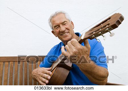 mature man playing guitar View Large Photo Image Stock Image - mature man playing guitar. Fotosearch