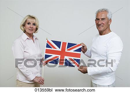mature people holding British flag View Large Photo Image Stock Image - mature people holding British flag. Fotosearch