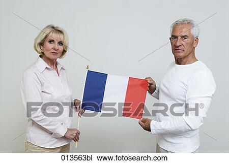 mature woman and mature man holding flag of France View Large Photo Image Stock Image - mature woman and mature man holding flag of France. Fotosearch