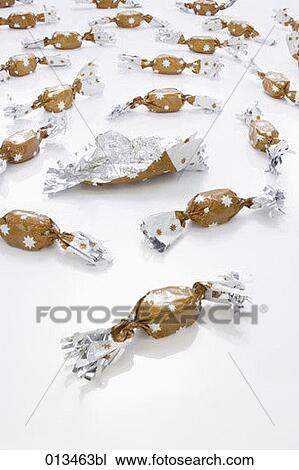 multitude of candies in brown wrapping one already opened View Large Photo Image Stock Image - multitude of candies in brown wrapping one already opened. Fotosearch