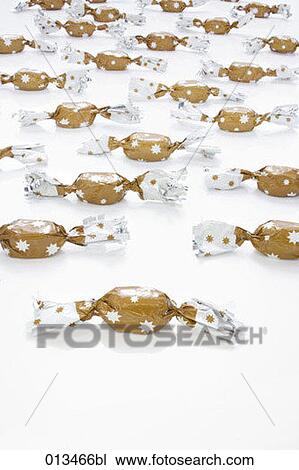 multitude of candies in brown wrapping View Large Photo Image Stock Image - multitude of candies in brown wrapping. Fotosearch