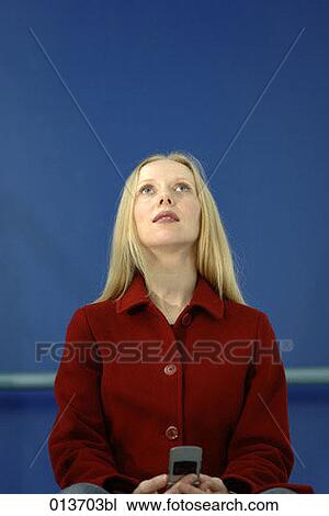 portrait of blond woman with mobile phone looking up View Large Photo Image Stock Image - portrait of blond woman with mobile phone looking up. Fotosearch