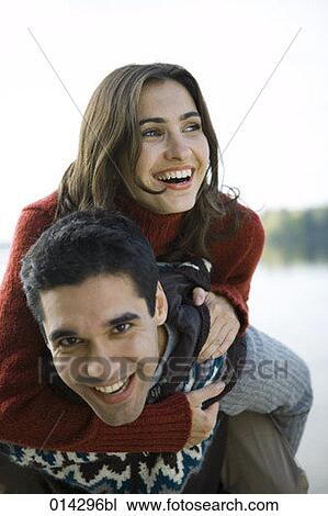 portrait of joyous couple playing piggyback View Large Photo Image Stock Image - portrait of joyous couple playing piggyback. Fotosearch