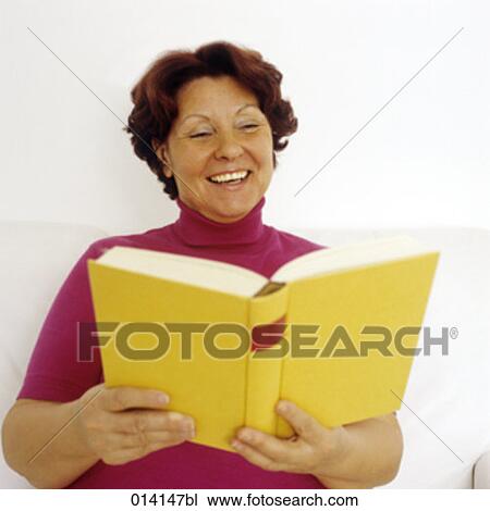 portrait of joyous mature woman reading View Large Photo Image Stock Image - portrait of joyous mature woman reading. Fotosearch