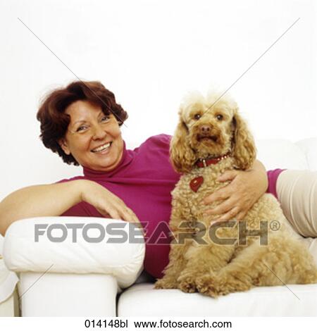 portrait of mature woman lying on sofa with her dog View Large Photo Image Stock Image - portrait of mature woman lying on sofa with her dog. Fotosearch