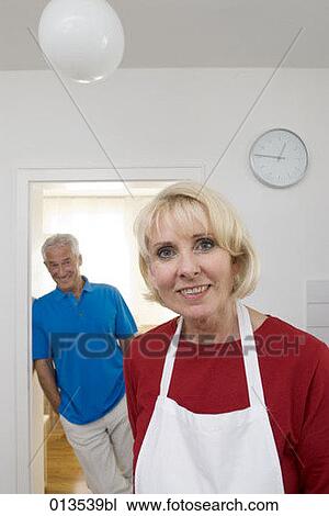 portrait of mature woman with man standing in the background View Large Photo Image Stock Image - portrait of mature woman with man standing in the background. Fotosearch