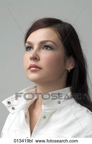 Stock Image - portrait of proud looking young woman. Fotosearch
