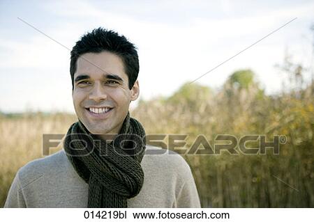 portrait of smiling young man wearing scarf View Large Photo Image Stock Image - portrait of smiling young man wearing scarf. Fotosearch