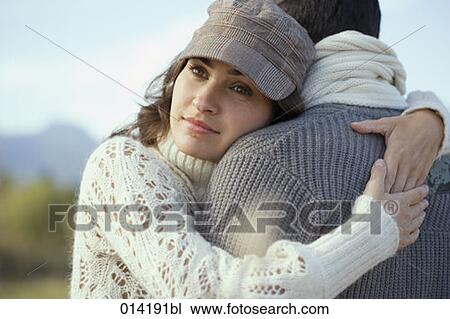 portrait of wistful looking woman embracing man View Large Photo Image Stock Image - portrait of wistful looking woman embracing man. Fotosearch