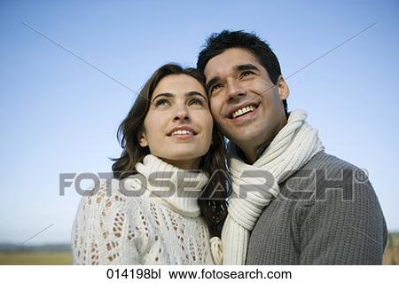 portrait of young couple looking up View Large Photo Image Stock Image - portrait of young couple looking up. Fotosearch