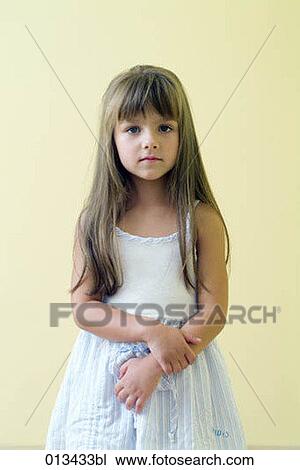 portrait of young girl in light blue dress View Large Photo Image Stock Image - portrait of young girl in light blue dress. Fotosearch