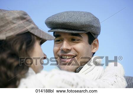 portrait of young man with flat cap looking at woman View Large Photo Image Stock Image - portrait of young man with flat cap looking at woman. Fotosearch