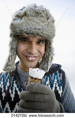 portrait of young man with fur hat and ice cream View Large Photo Image Stock Image - portrait of young man with fur hat and ice cream. Fotosearch