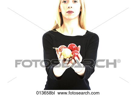 portrait of young woman holding baubles View Large Photo Image Stock Image - portrait of young woman holding baubles. Fotosearch