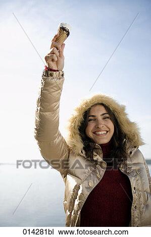 portrait of young woman holding ice in the air View Large Photo Image Stock Image - portrait of young woman holding ice in the air. Fotosearch