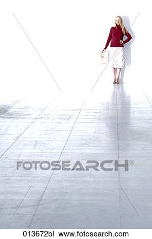 portrait of young woman holding newspaper View Large Photo Image Stock Image - portrait of young woman holding newspaper. Fotosearch