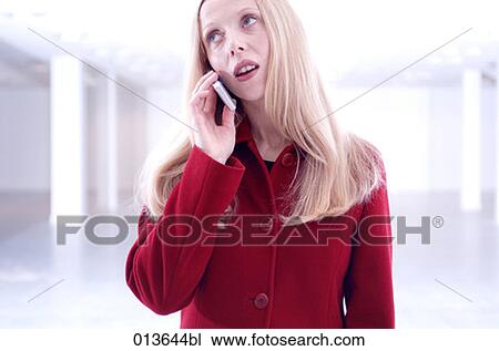 portrait of young woman listening to cellphone with thoughtful expression View Large Photo Image Stock Image - portrait of young woman listening to cellphone with thoughtful expression. Fotosearch