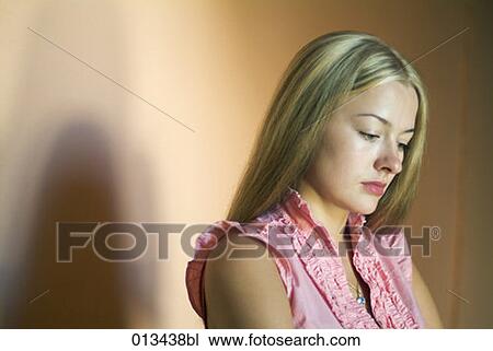 sad looking woman with dark shadow behind her View Large Photo Image Stock Image - sad looking woman with dark shadow behind her. Fotosearch