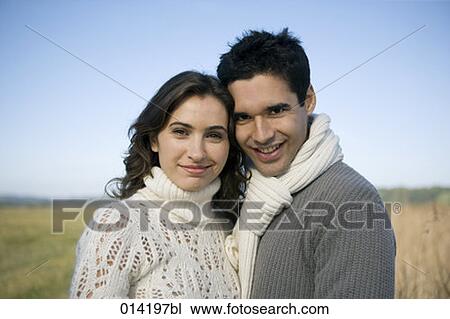 smiling young couple looking at camera View Large Photo Image Stock Image - smiling young couple looking at camera. Fotosearch
