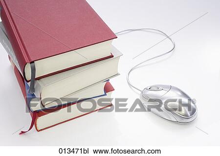 Stock Image - still life of books with computer mouse. Fotosearch